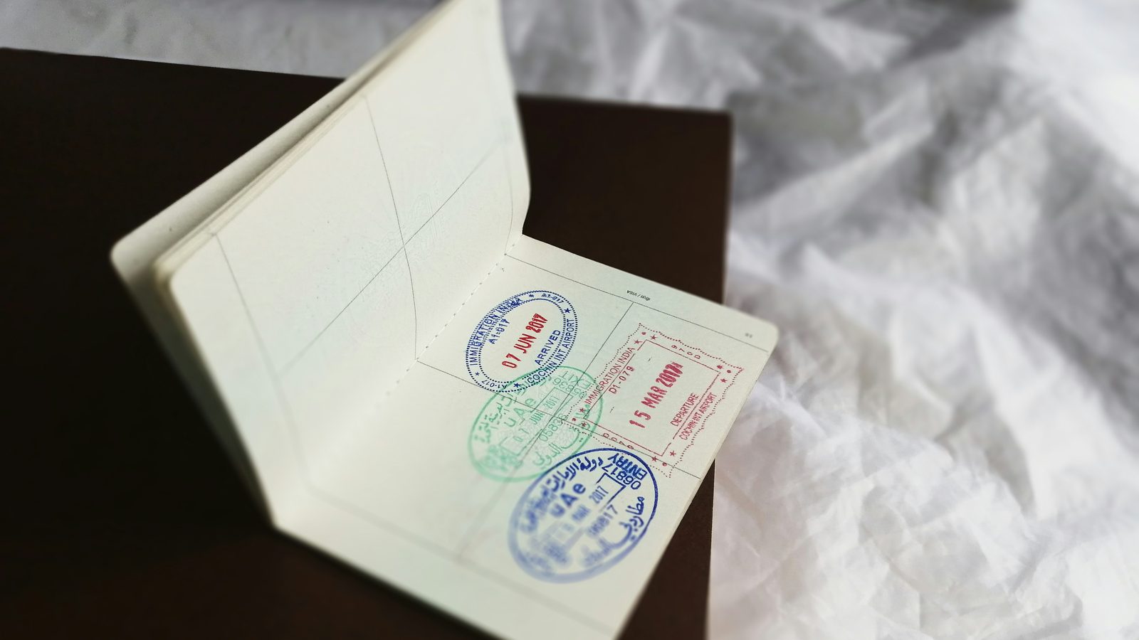 An open passport page carrying entry stamps